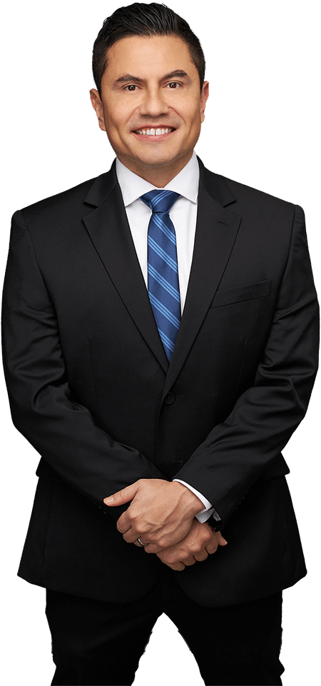 Octavio Duran in a dark suit and blue tie